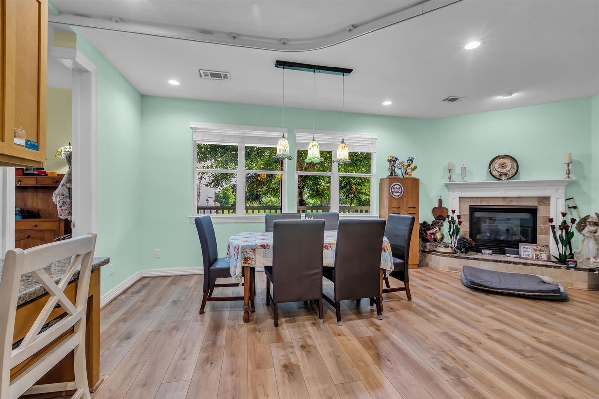 Dining room, Fireplace, Interior, Pendant Lights, Recessed Lighting, Wood Texture Flooring