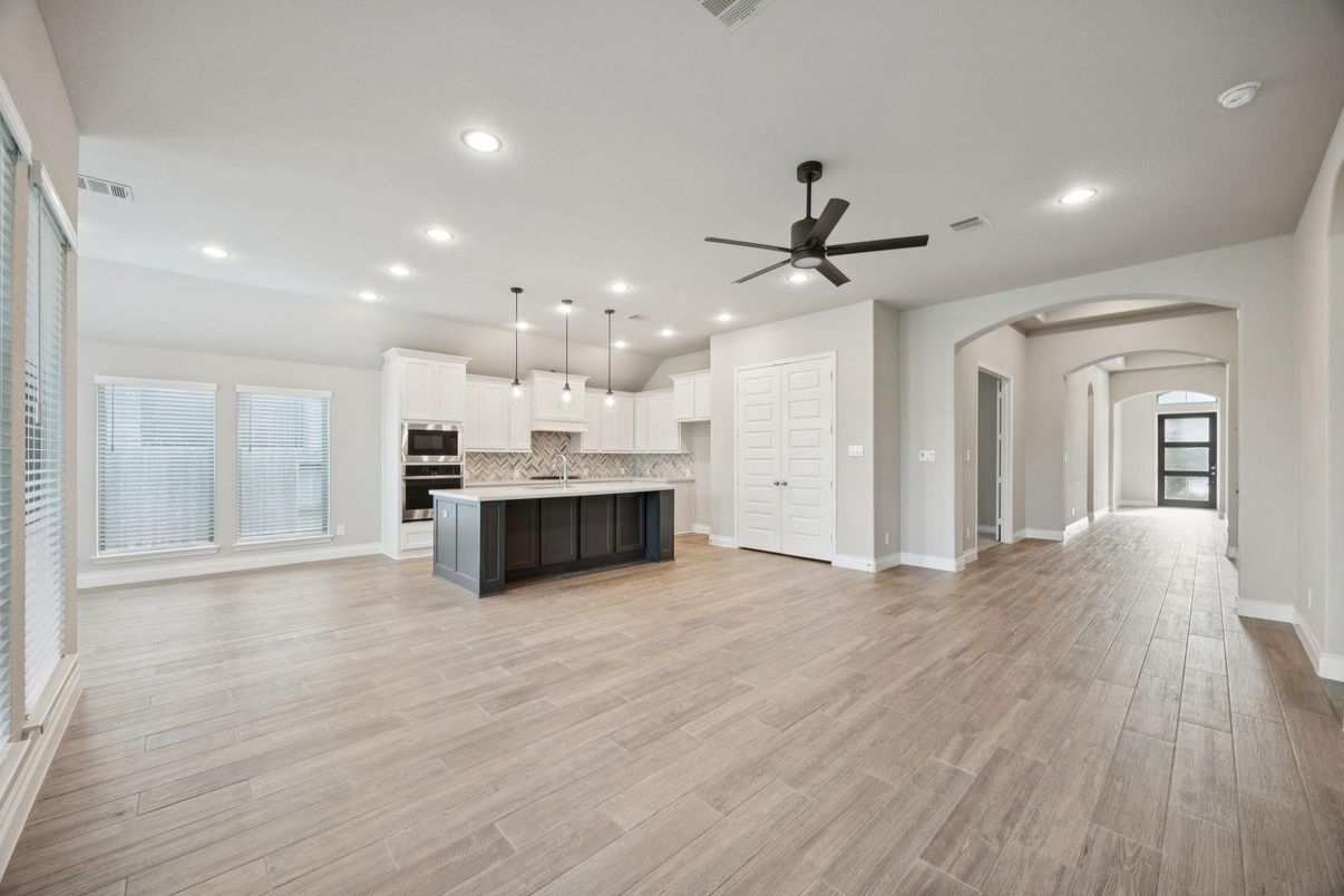 Empty room, Interior, Kitchen, Pendant Lights, Recessed Lighting, Stainless Steel Appliances, Wood Texture Flooring