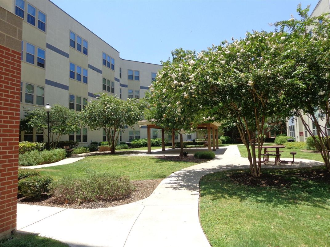 Exterior, Facade, Brick Facade, Condo Building