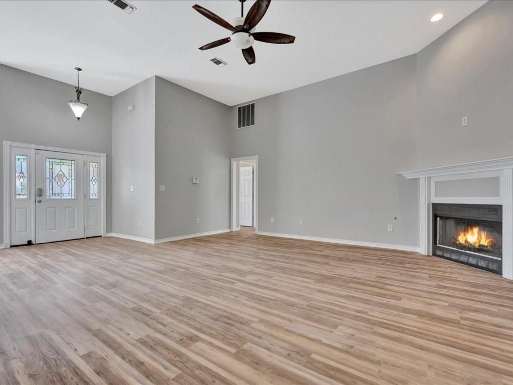 Empty room, Fireplace, Interior, Pendant Lights, Recessed Lighting, Wood Texture Flooring
