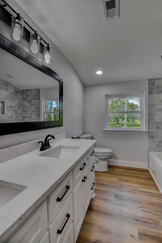 Bathroom, Dual Sink Vanities, Interior, Recessed Lighting, Wood Texture Flooring