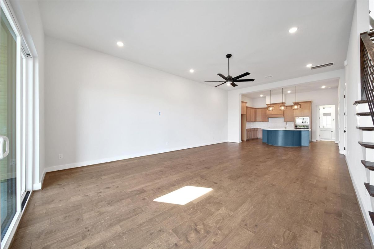 Empty room, Interior, Kitchen, Pendant Lights, Recessed Lighting, Stainless Steel Appliances, Wood Texture Flooring