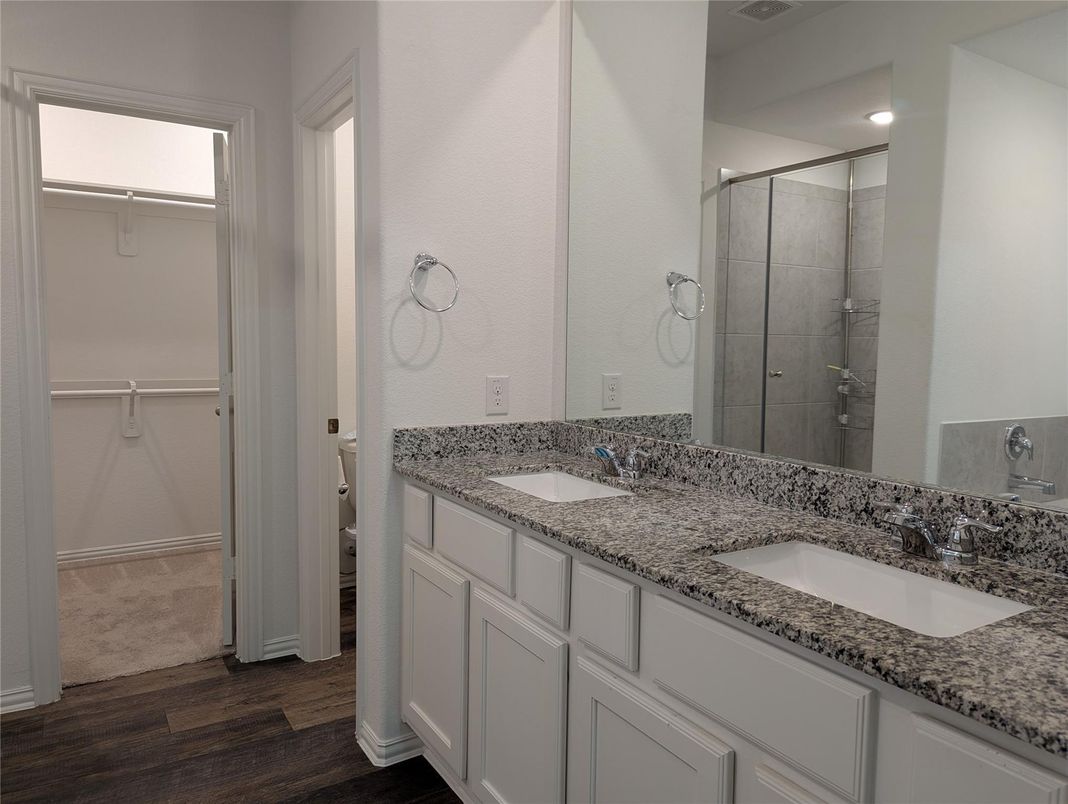 Bathroom, Dual Sink Vanities, Glass Shower, Interior, Recessed Lighting, Wood Texture Flooring