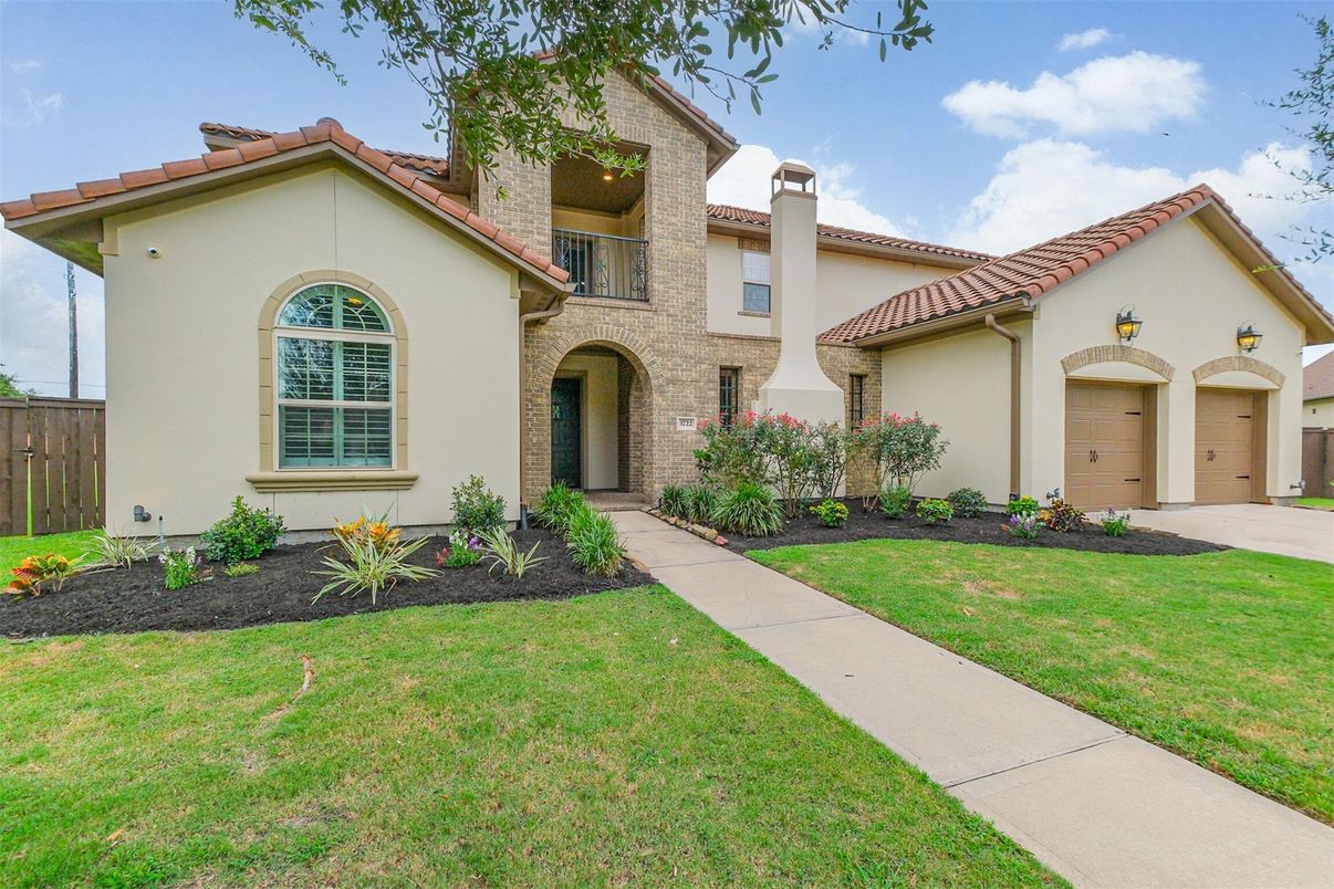 Attached, Backyard, Exterior, Facade, Brick Facade, Spanish Mediterranean