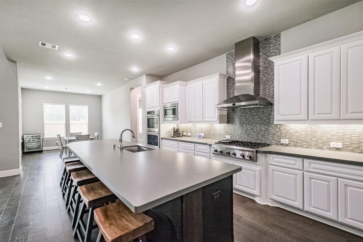 Dining room, Interior, Kitchen, Recessed Lighting, Stainless Steel Appliances, Wood Texture Flooring