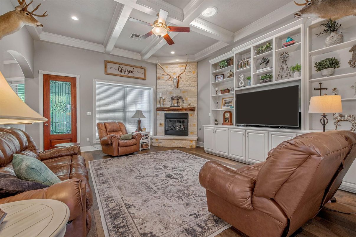 Fireplace, Interior, Living room, Recessed Lighting, Stone Walls, Wood Texture Flooring