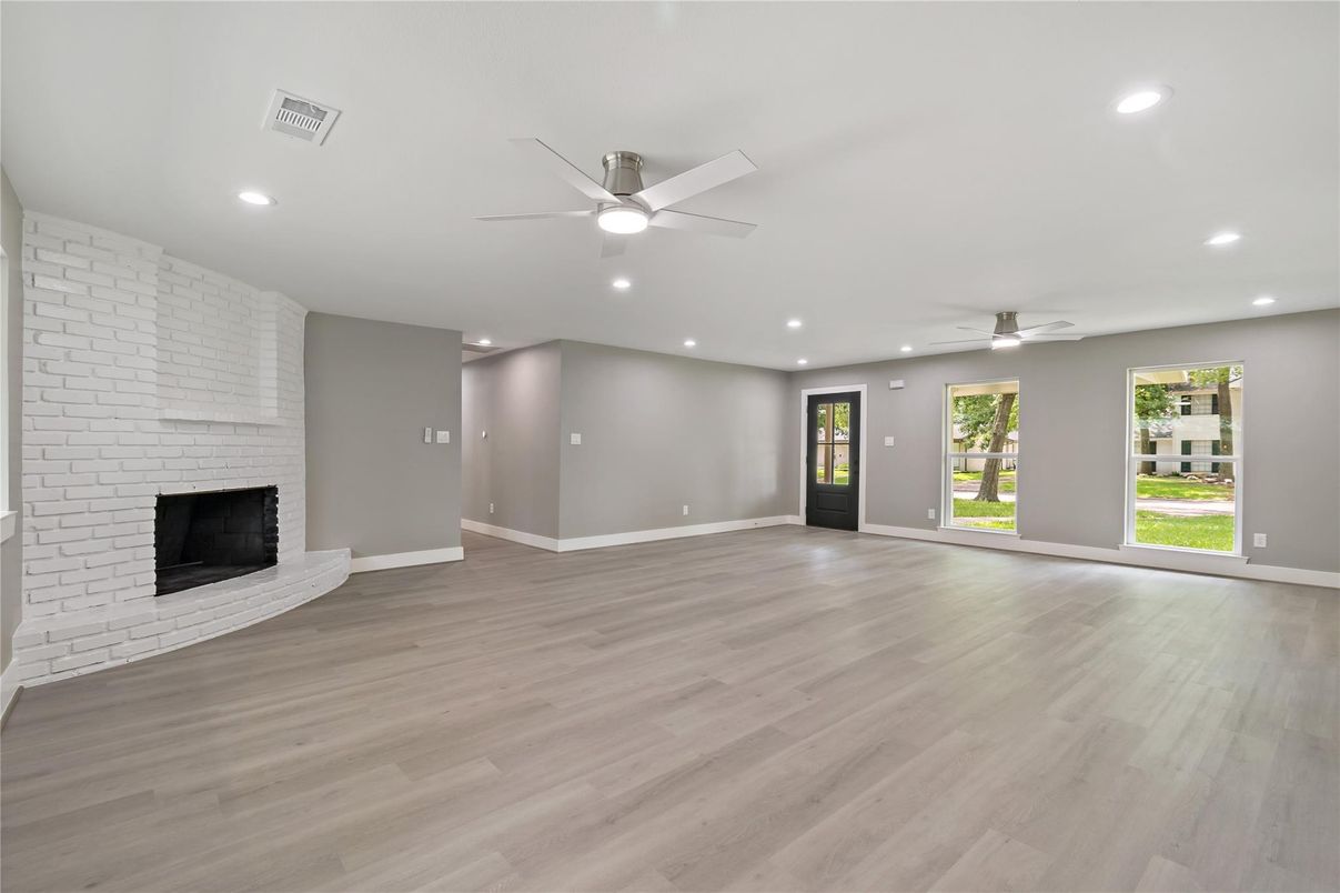 Empty room, Fireplace, Interior, Recessed Lighting, Stone Walls, Wood Texture Flooring