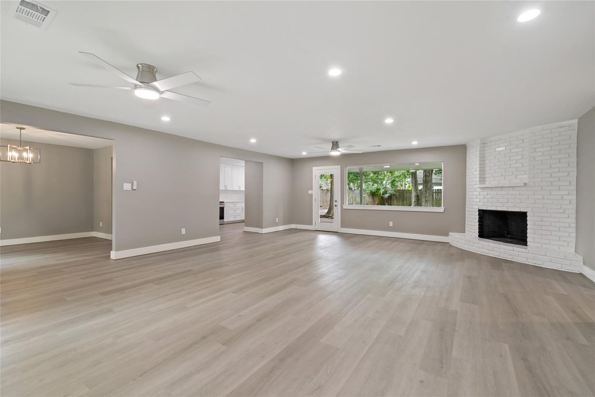 Empty room, Fireplace, Interior, Pendant Lights, Recessed Lighting, Stone Walls, Wood Texture Flooring