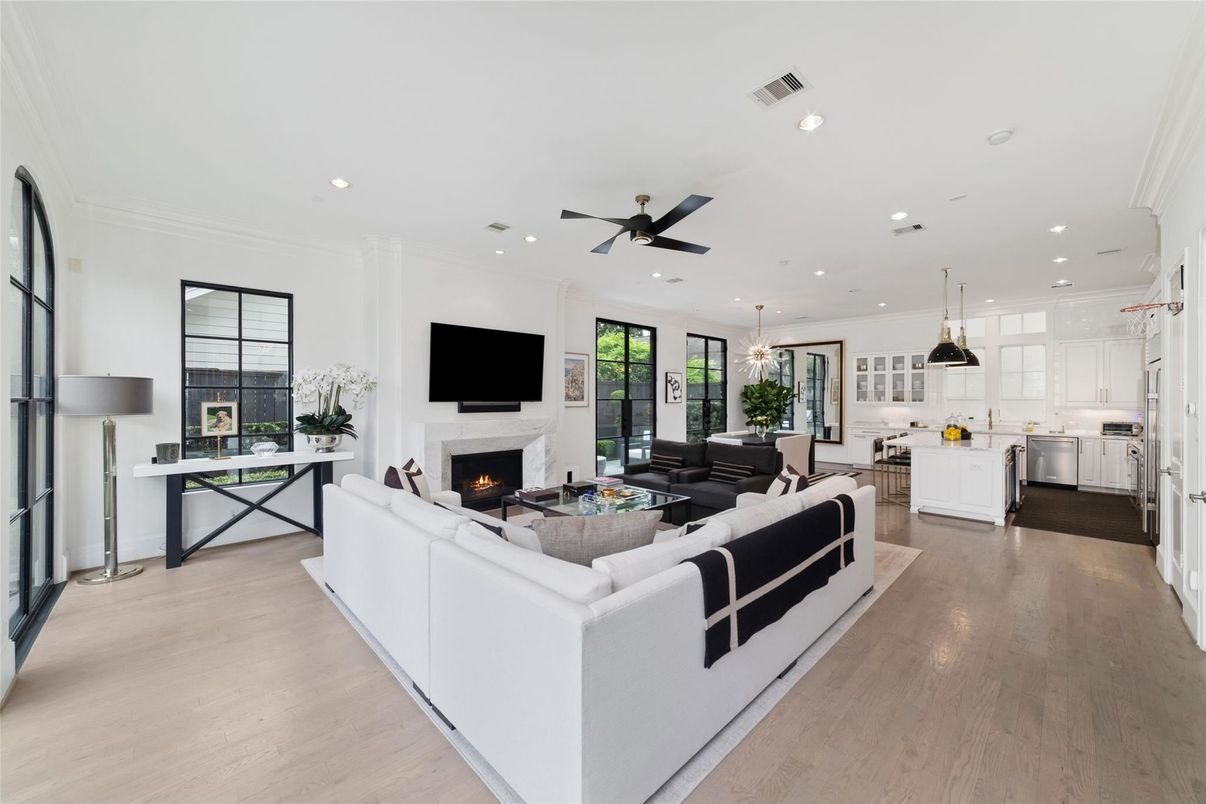 Dining room, Fireplace, Interior, Kitchen, Living room, Pendant Lights, Recessed Lighting, Stainless Steel Appliances, Wood Texture Flooring