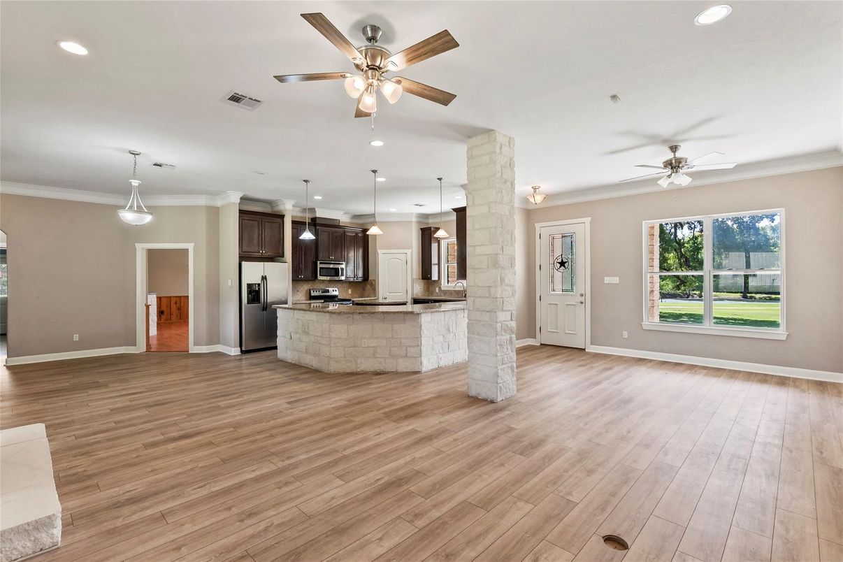Empty room, Interior, Kitchen, Pendant Lights, Recessed Lighting, Stainless Steel Appliances, Wood Texture Flooring
