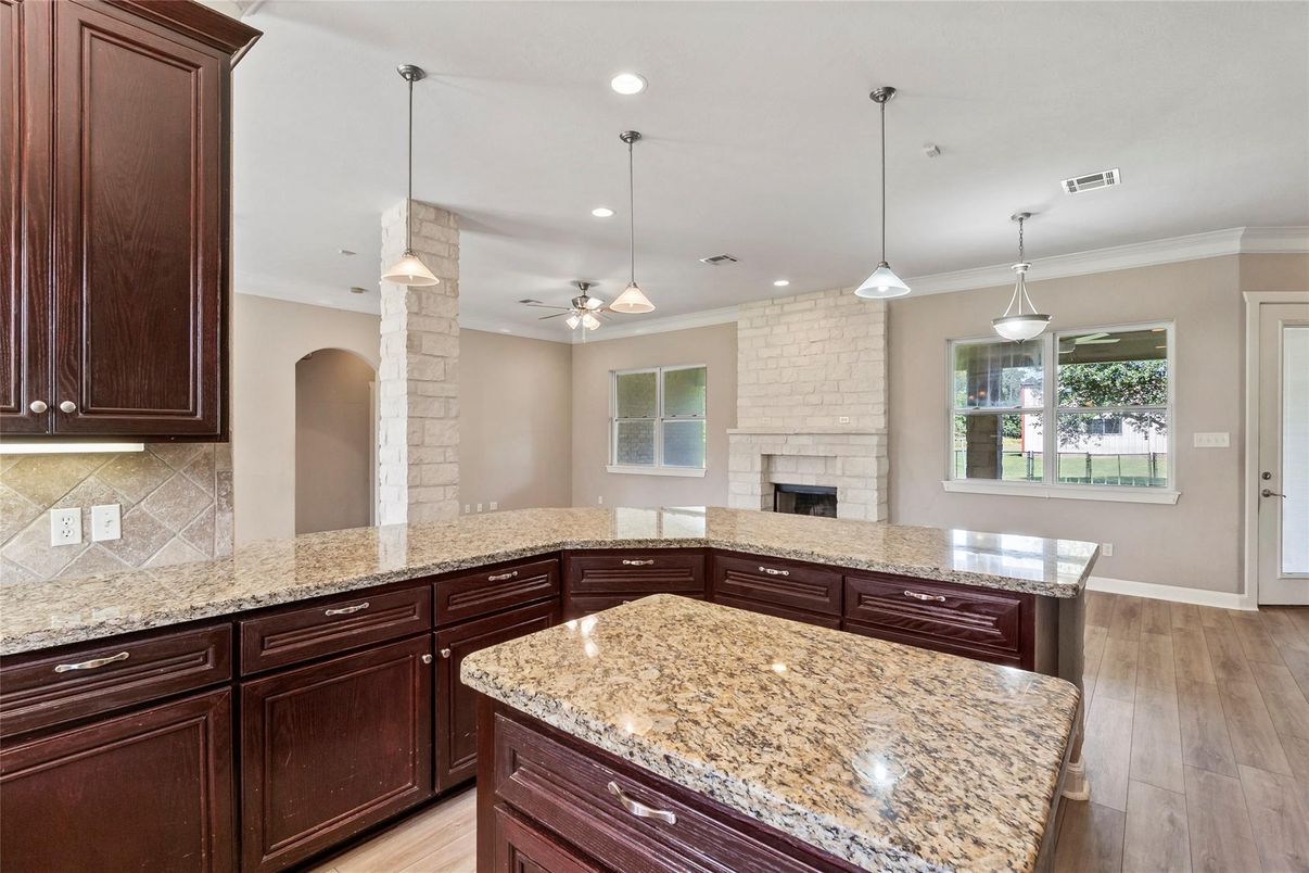 Fireplace, Interior, Pendant Lights, Recessed Lighting, Stone Walls, Wood Texture Flooring