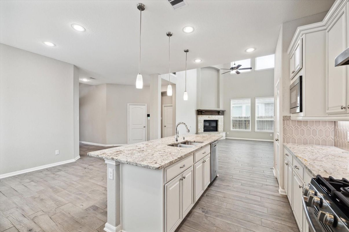 Fireplace, Interior, Kitchen, Pendant Lights, Recessed Lighting, Stainless Steel Appliances, Wood Texture Flooring