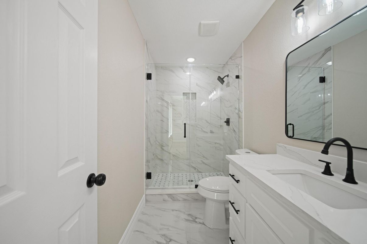 Bathroom, Dual Sink Vanities, Glass Shower, Interior, Marble, Marble Walls, Recessed Lighting