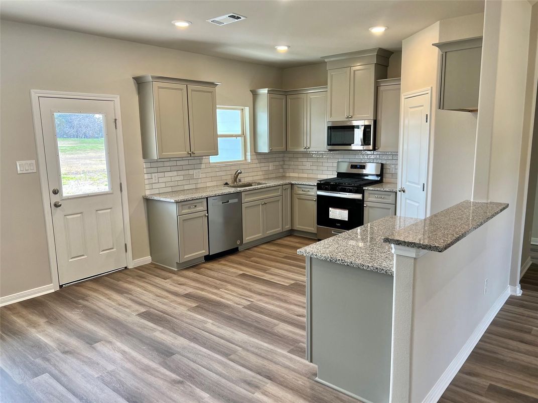 Interior, Kitchen, Recessed Lighting, Stainless Steel Appliances, Wood Texture Flooring