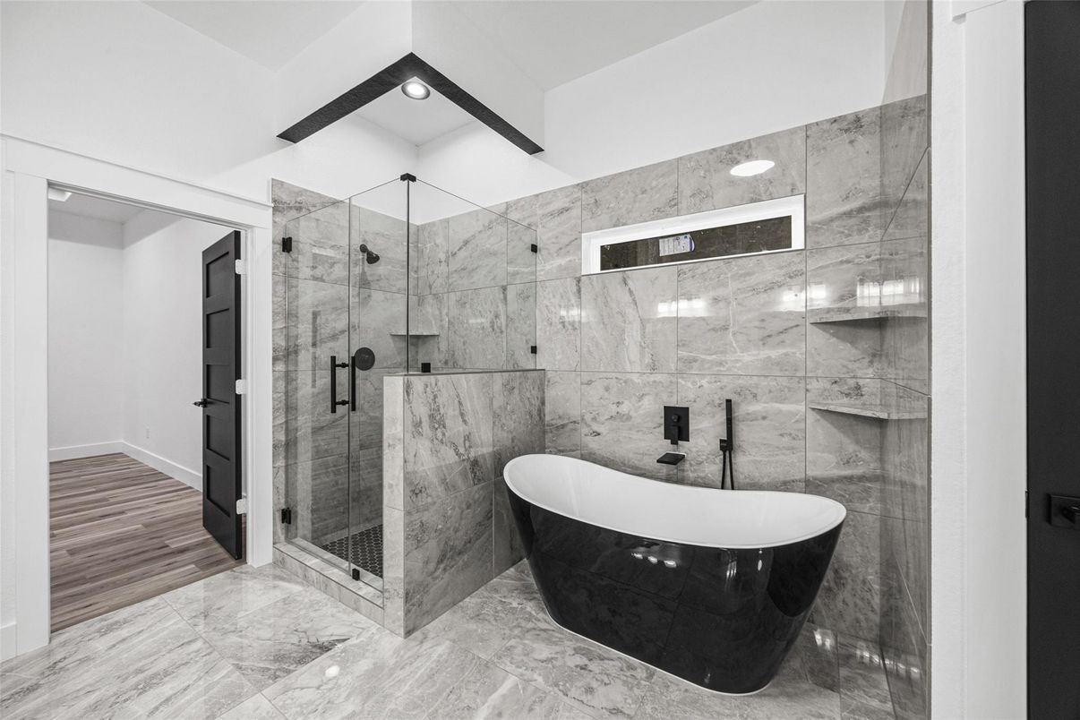Bathroom, Free Standing Baths, Glass Shower, Interior, Marble, Marble Walls, Recessed Lighting, Wood Texture Flooring