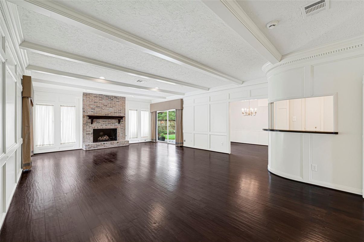 Chandelier, Empty room, Fireplace, Interior, Recessed Lighting, Stone Walls, Wood Texture Flooring