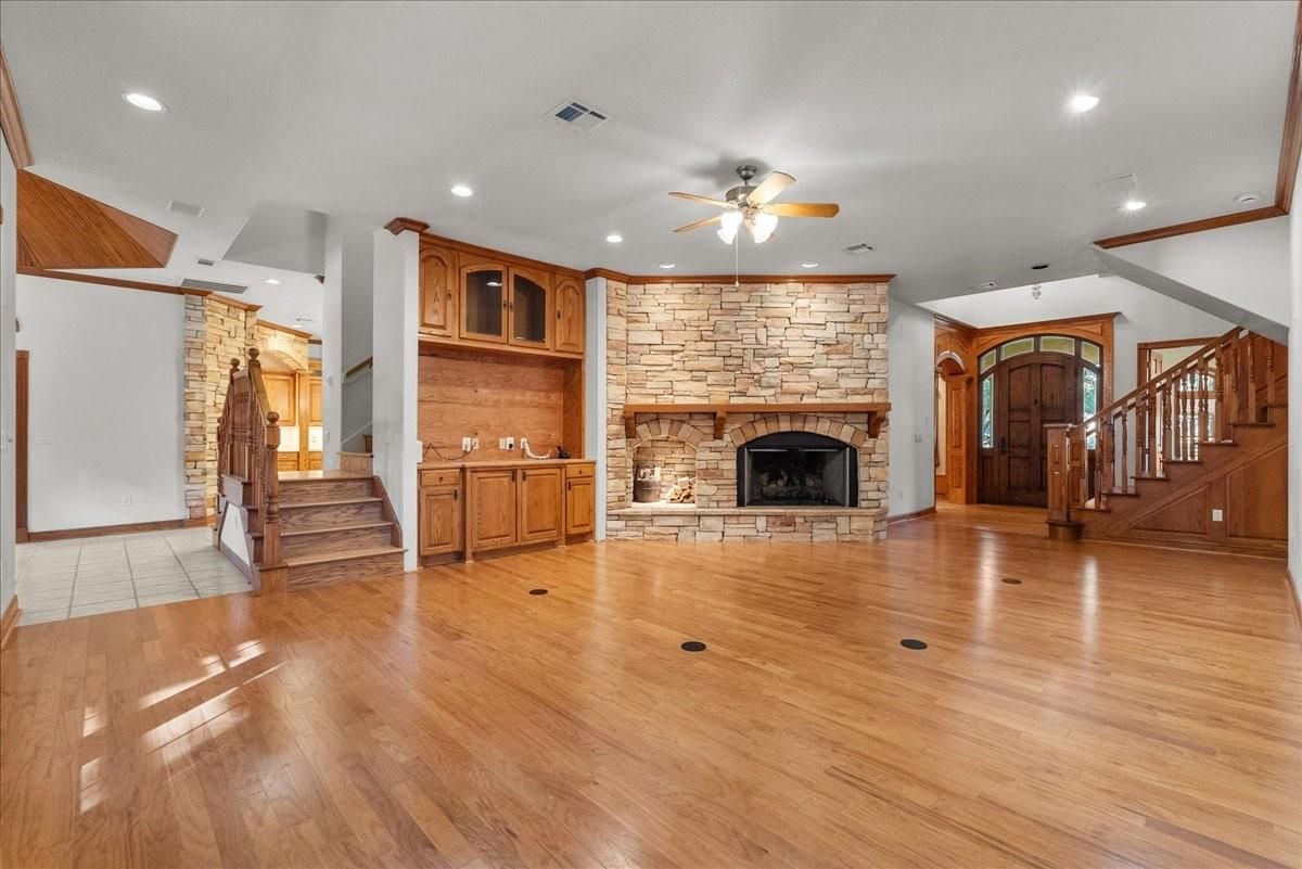 Empty room, Fireplace, Interior, Recessed Lighting, Stone Walls, Wood Texture Flooring