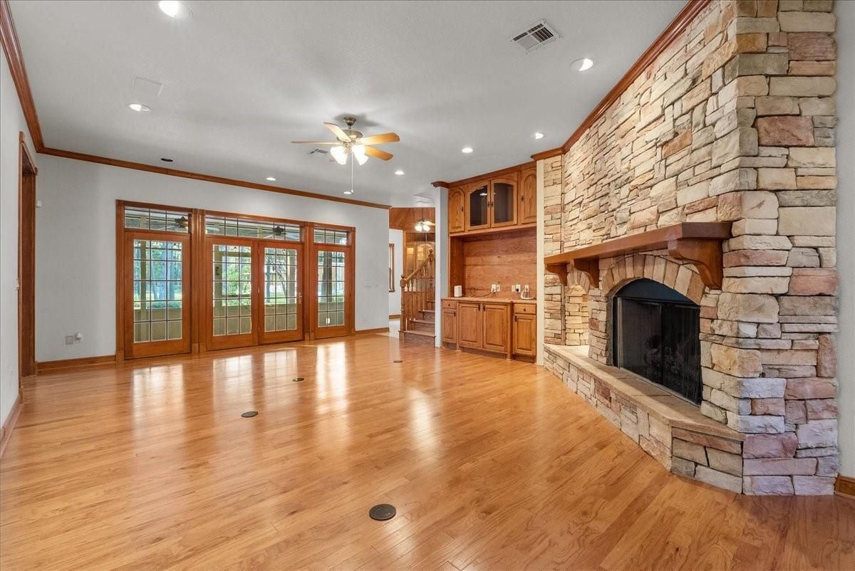 Empty room, Fireplace, Interior, Recessed Lighting, Stone Walls, Wood Texture Flooring