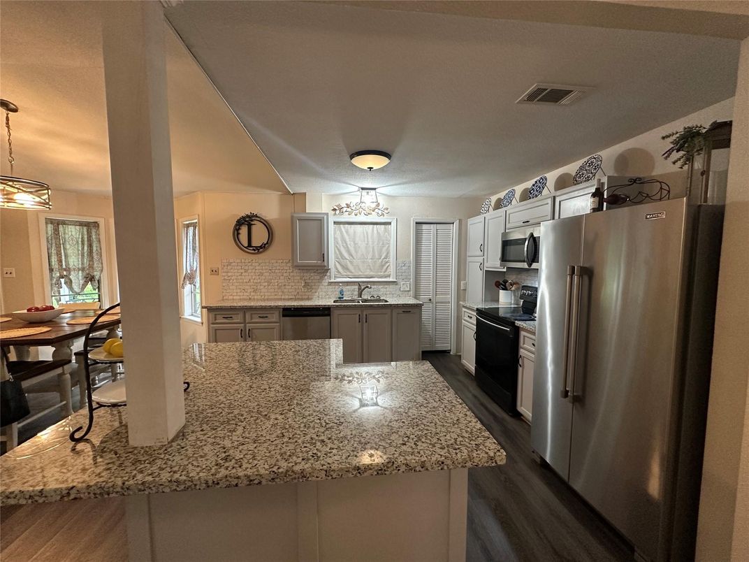 Dining room, Interior, Kitchen, Pendant Lights, Stainless Steel Appliances, Wood Texture Flooring