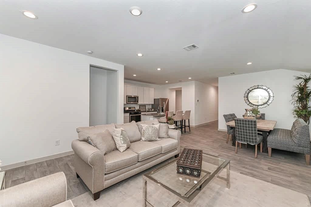 Dining room, Interior, Kitchen, Living room, Recessed Lighting, Stainless Steel Appliances, Wood Texture Flooring