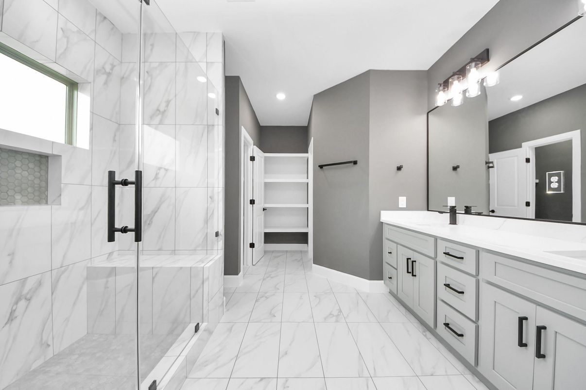 Bathroom, Dual Sink Vanities, Glass Shower, Interior, Marble, Marble Walls, Recessed Lighting, Walk-in Closets