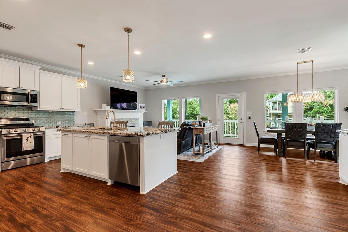 Dining room, Interior, Kitchen, Pendant Lights, Recessed Lighting, Stainless Steel Appliances, Wood Texture Flooring