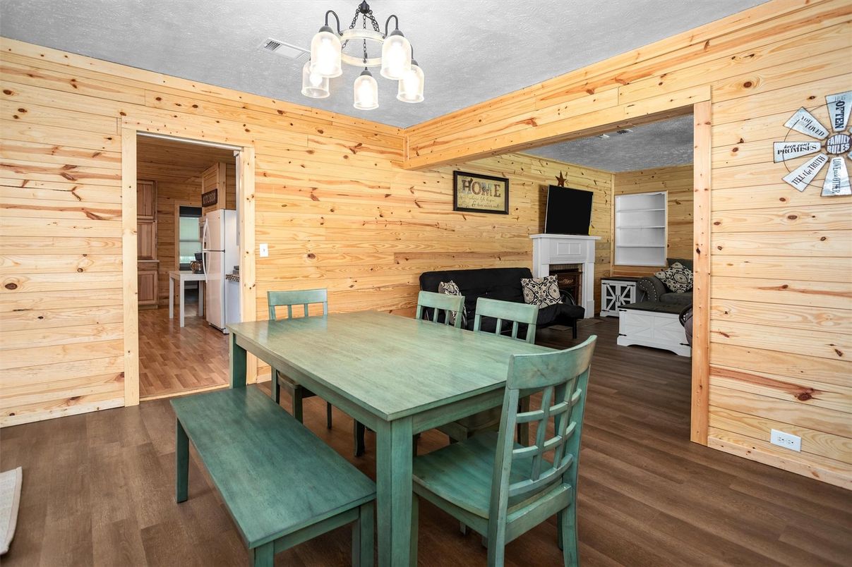 Chandelier, Dining room, Fireplace, Interior, Wood Texture Flooring, Wooden Walls