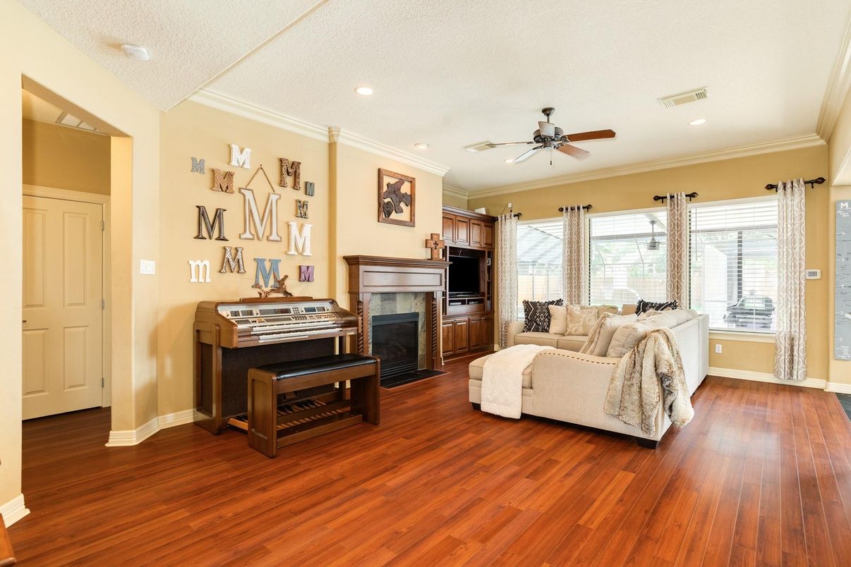 Fireplace, Interior, Living room, Piano, Recessed Lighting, Wood Texture Flooring