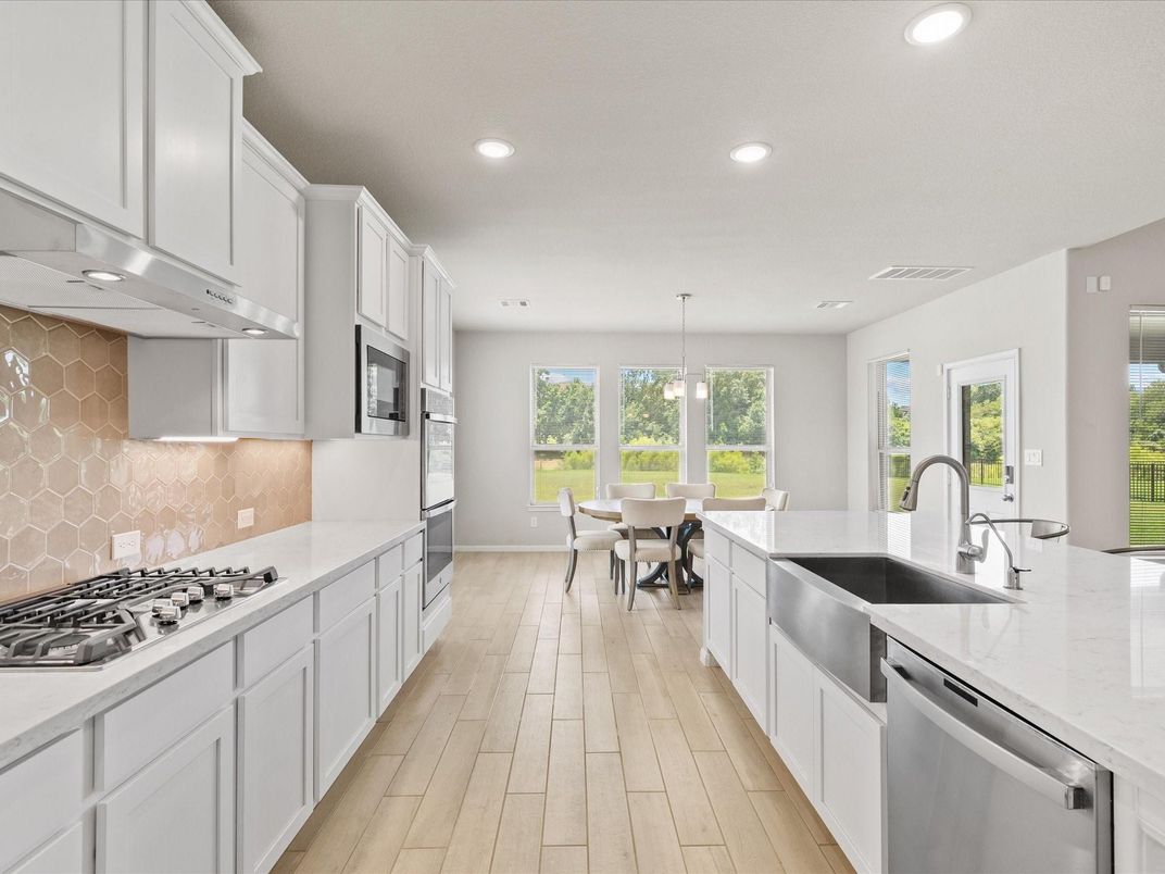 Dining room, Interior, Kitchen, Pendant Lights, Recessed Lighting, Stainless Steel Appliances, Wood Texture Flooring