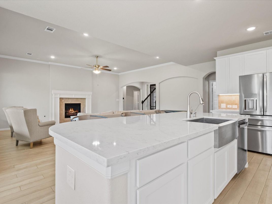 Fireplace, Interior, Kitchen, Recessed Lighting, Stainless Steel Appliances, Wood Texture Flooring