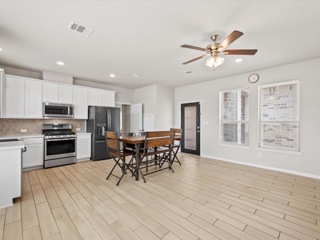 Dining room, Interior, Kitchen, Recessed Lighting, Stainless Steel Appliances, Wood Texture Flooring