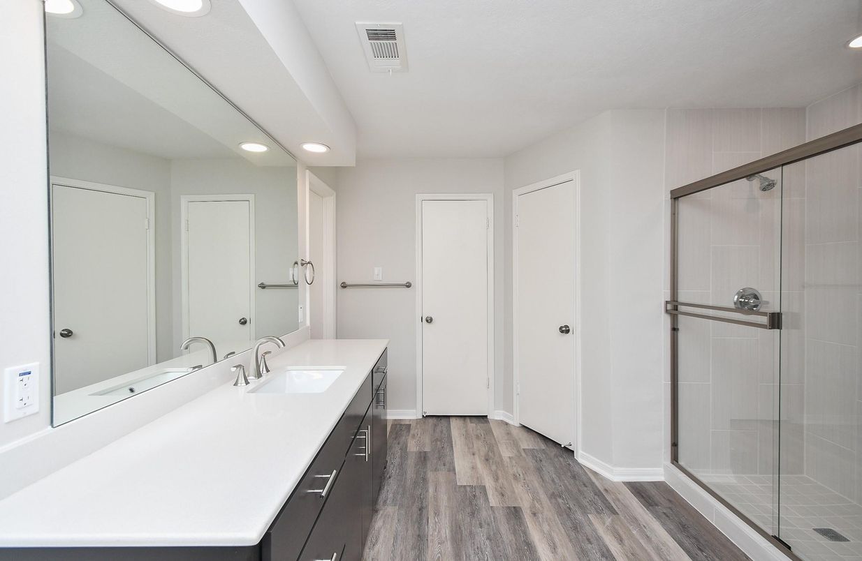 Bathroom, Dual Sink Vanities, Glass Shower, Interior, Recessed Lighting, Wood Texture Flooring