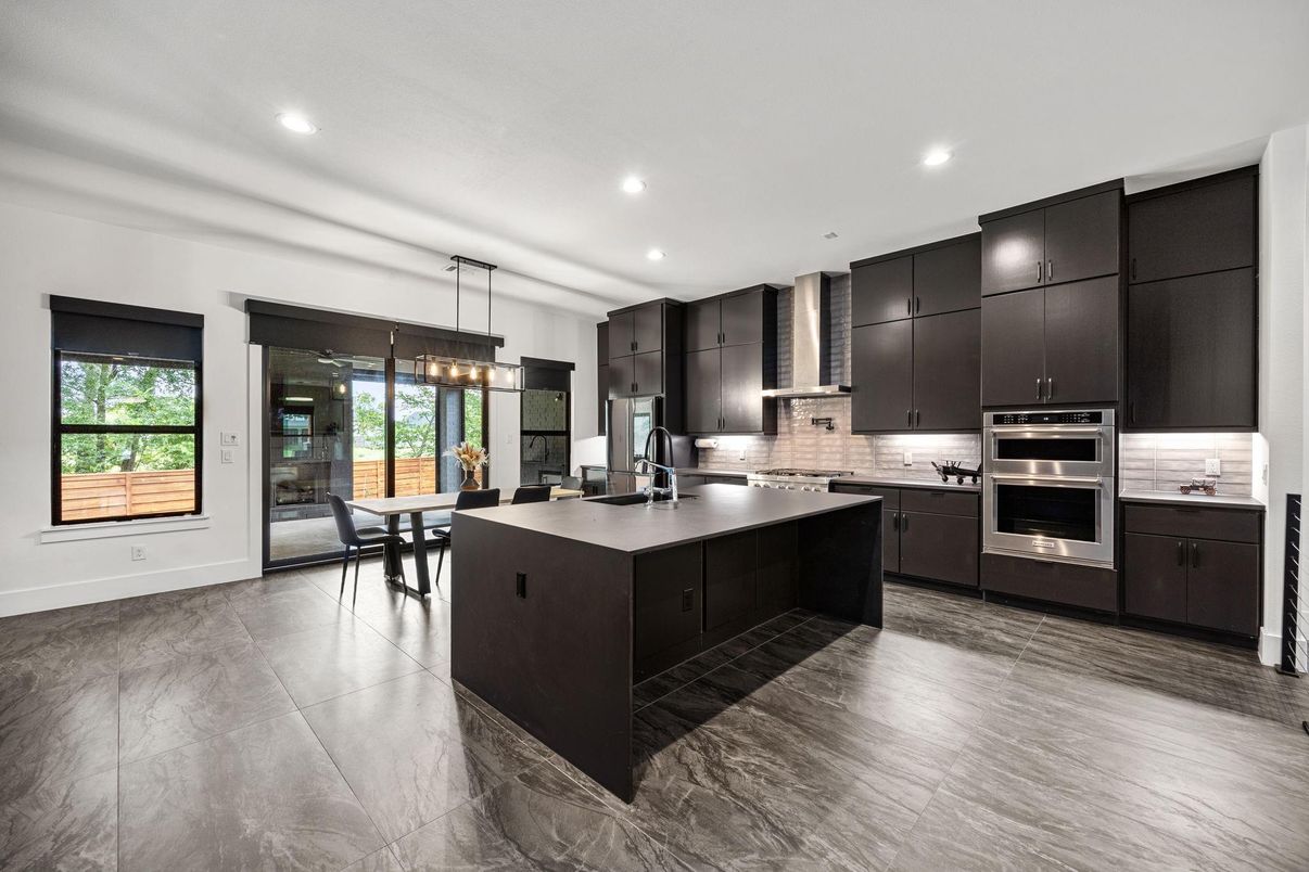 Chandelier, Dining room, Interior, Kitchen, Pendant Lights, Recessed Lighting, Stainless Steel Appliances, Wood Texture Flooring