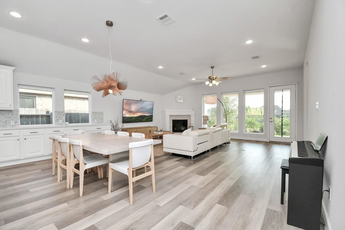Dining room, Fireplace, Interior, Living room, Pendant Lights, Recessed Lighting, Wood Texture Flooring