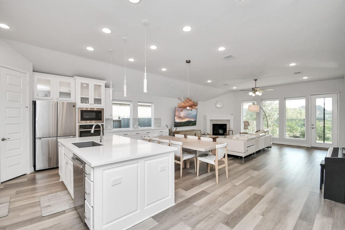 Dining room, Fireplace, Interior, Kitchen, Living room, Pendant Lights, Recessed Lighting, Stainless Steel Appliances, Wood Texture Flooring