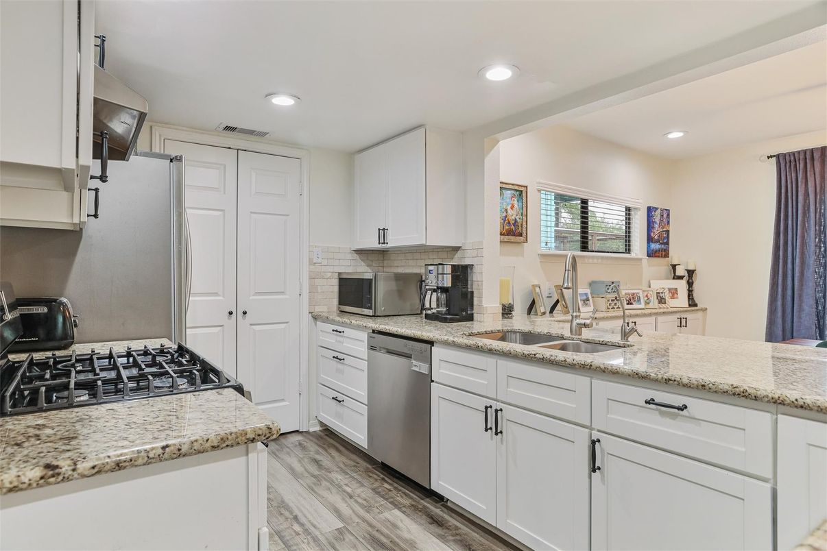 Dining room, Interior, Kitchen, Pendant Lights, Recessed Lighting, Stainless Steel Appliances, Wood Texture Flooring
