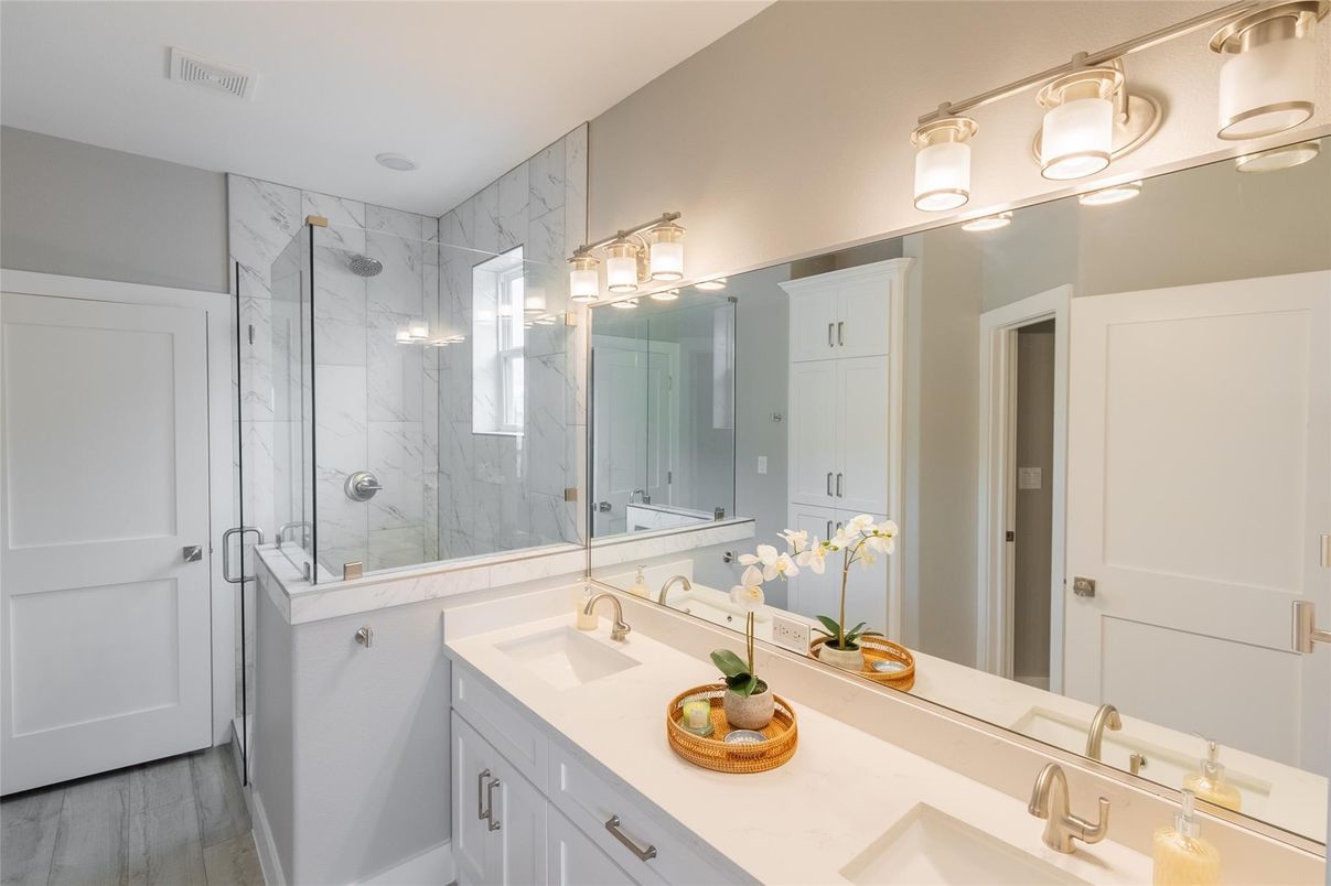 Bathroom, Dual Sink Vanities, Glass Shower, Interior, Marble Walls, Wood Texture Flooring