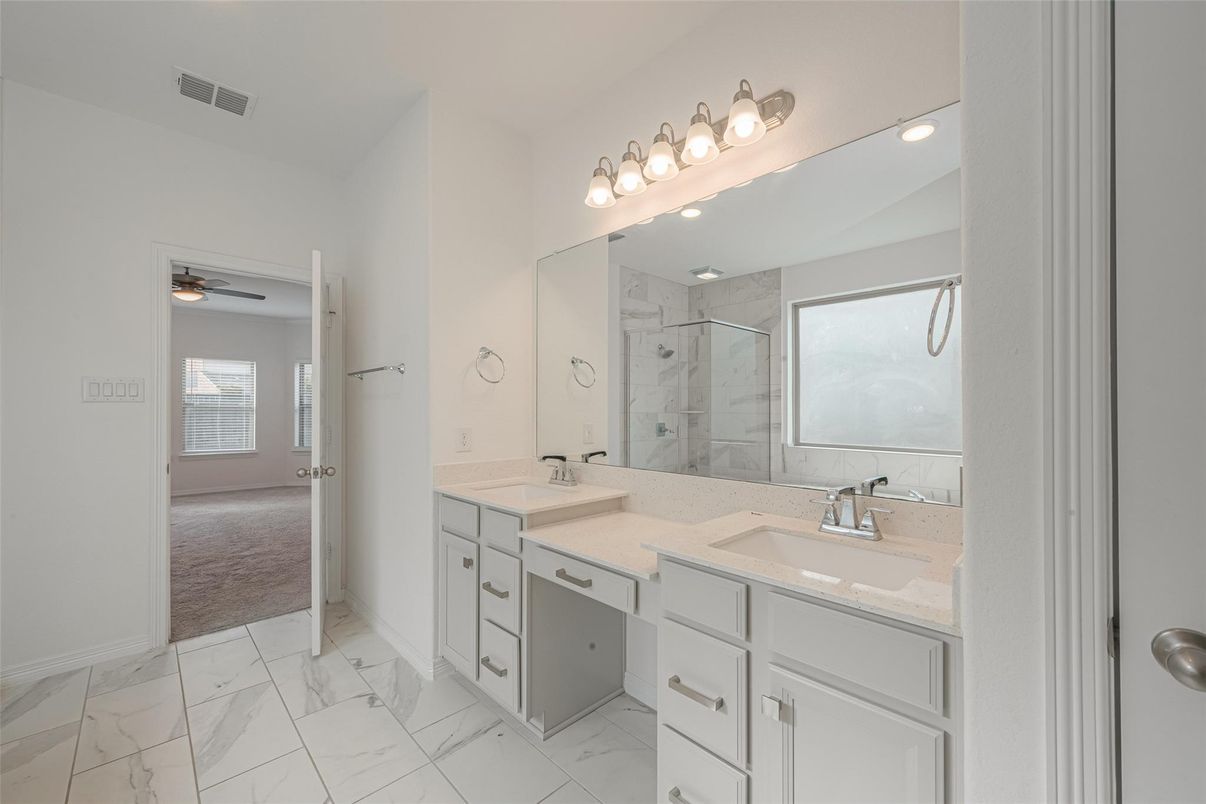 Bathroom, Dual Sink Vanities, Glass Shower, Interior, Marble, Marble Walls, Recessed Lighting
