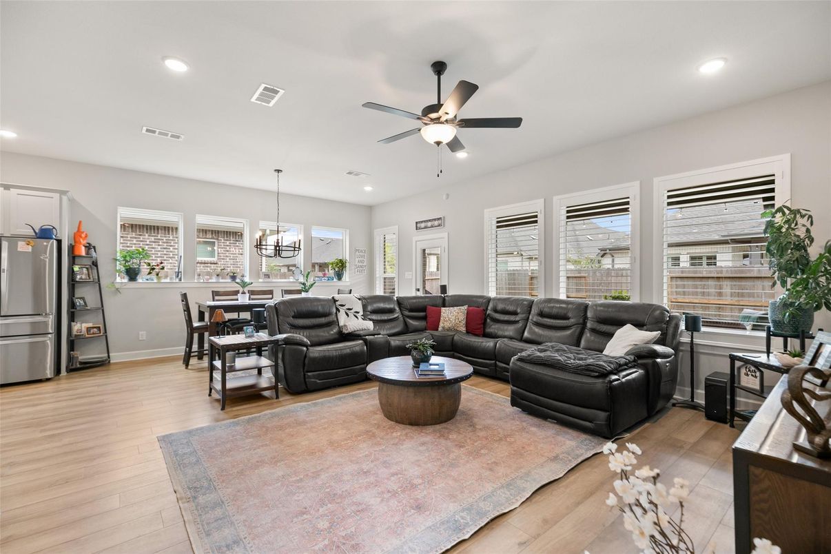 Chandelier, Dining room, Interior, Living room, Recessed Lighting, Stainless Steel Appliances, Wood Texture Flooring