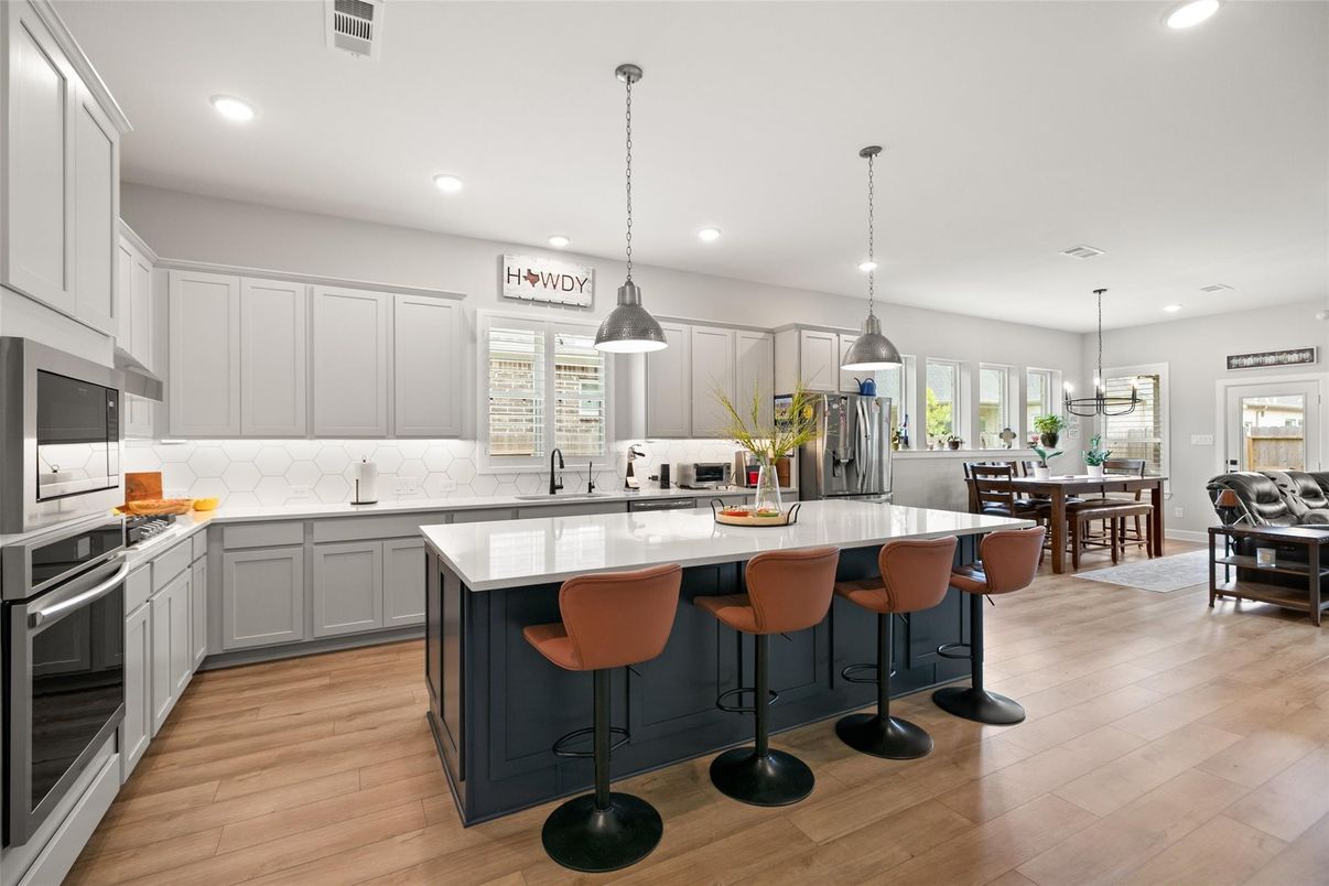 Dining room, Interior, Kitchen, Pendant Lights, Recessed Lighting, Stainless Steel Appliances, Wood Texture Flooring