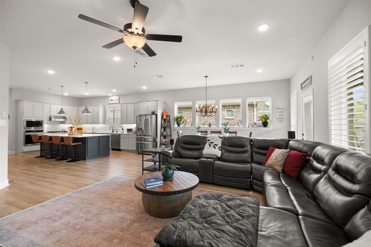 Chandelier, Dining room, Interior, Kitchen, Living room, Pendant Lights, Recessed Lighting, Stainless Steel Appliances, Wood Texture Flooring