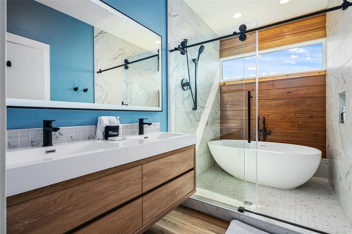 Bathroom, Dual Sink Vanities, Free Standing Baths, Glass Shower, Interior, Marble Walls, Recessed Lighting, Wood Texture Flooring, Wooden Walls
