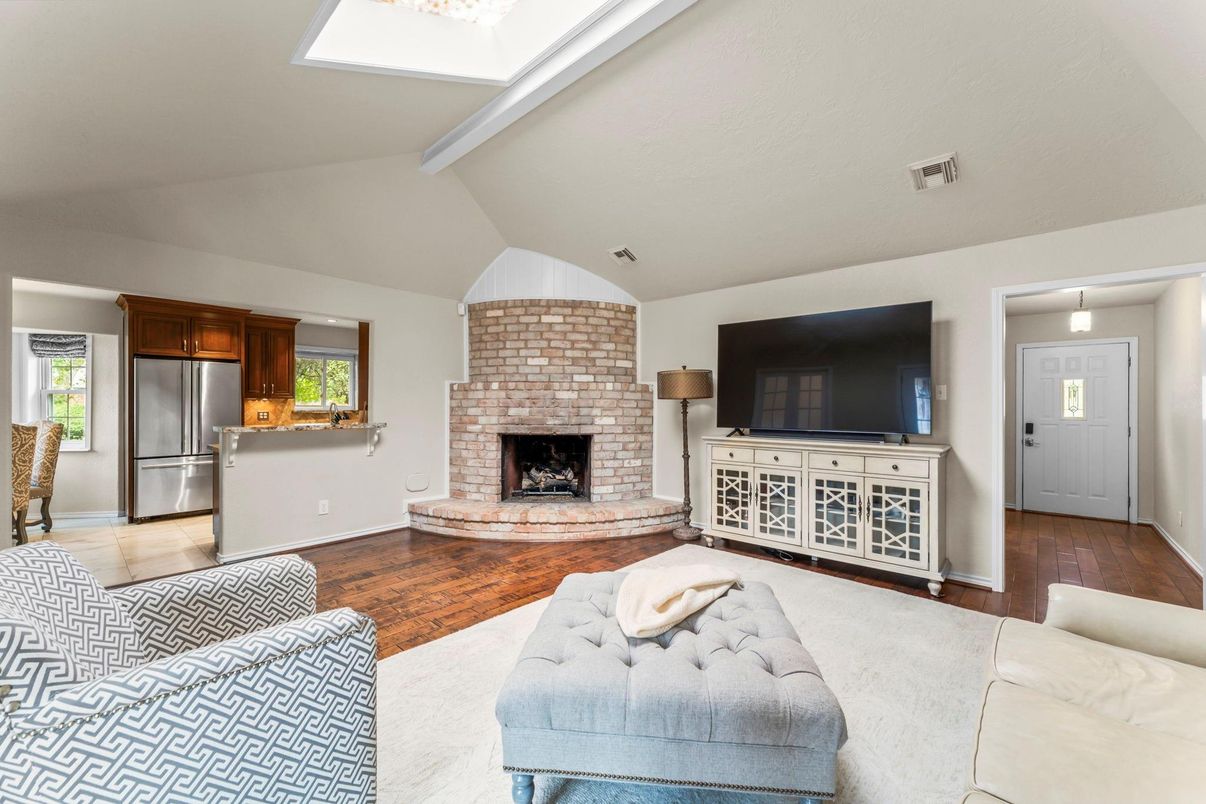 Fireplace, Interior, Kitchen, Pendant Lights, Stainless Steel Appliances, Stone Walls, Wood Texture Flooring