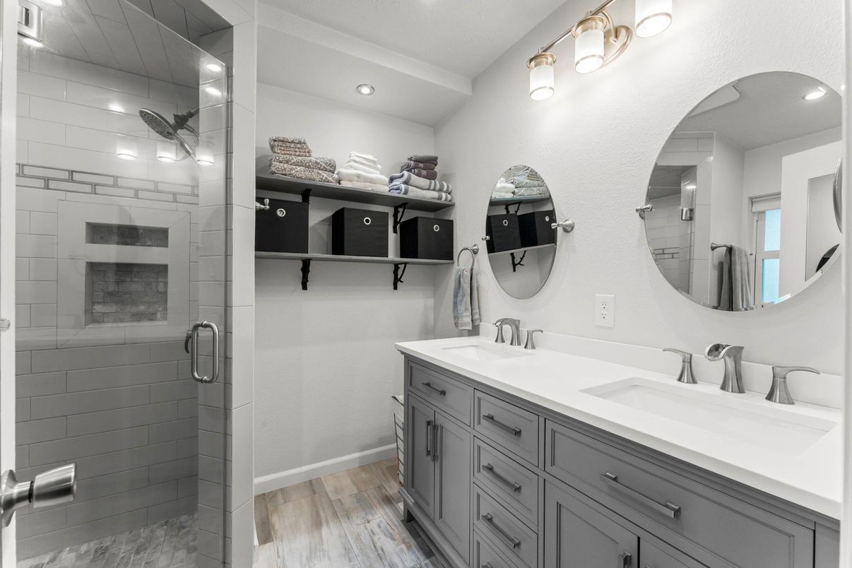 Bathroom, Dual Sink Vanities, Glass Shower, Interior, Recessed Lighting, Wood Texture Flooring