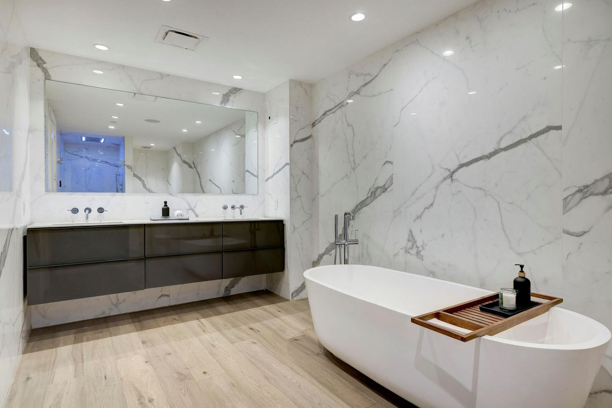Bathroom, Dual Sink Vanities, Free Standing Baths, Interior, Marble Walls, Recessed Lighting, Wood Texture Flooring