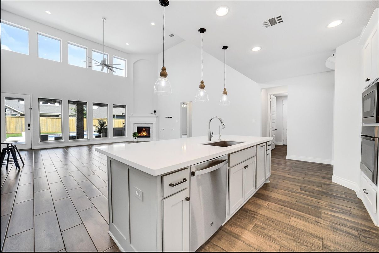 Fireplace, Interior, Kitchen, Pendant Lights, Recessed Lighting, Stainless Steel Appliances, Wood Texture Flooring