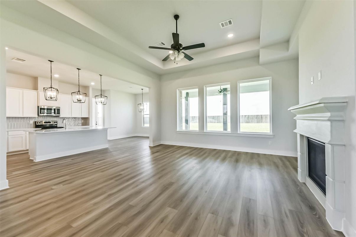 Empty room, Interior, Kitchen, Pendant Lights, Recessed Lighting, Stainless Steel Appliances, Wood Texture Flooring
