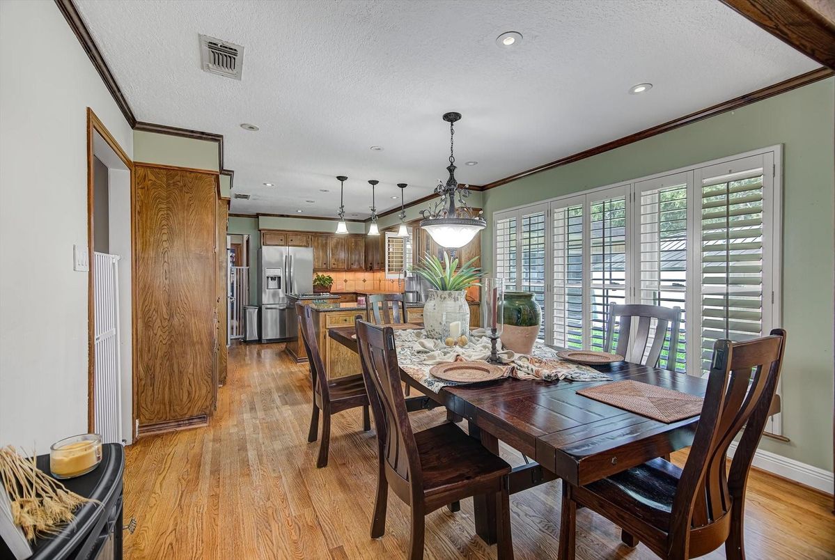 Dining room, Interior, Kitchen, Pendant Lights, Recessed Lighting, Stainless Steel Appliances, Wood Texture Flooring