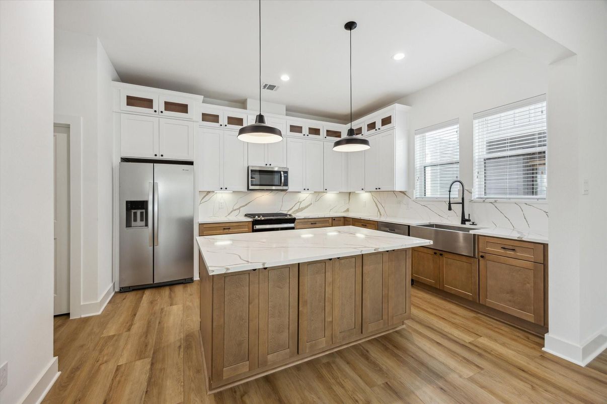Interior, Kitchen, Marble Walls, Pendant Lights, Recessed Lighting, Stainless Steel Appliances, Wood Texture Flooring