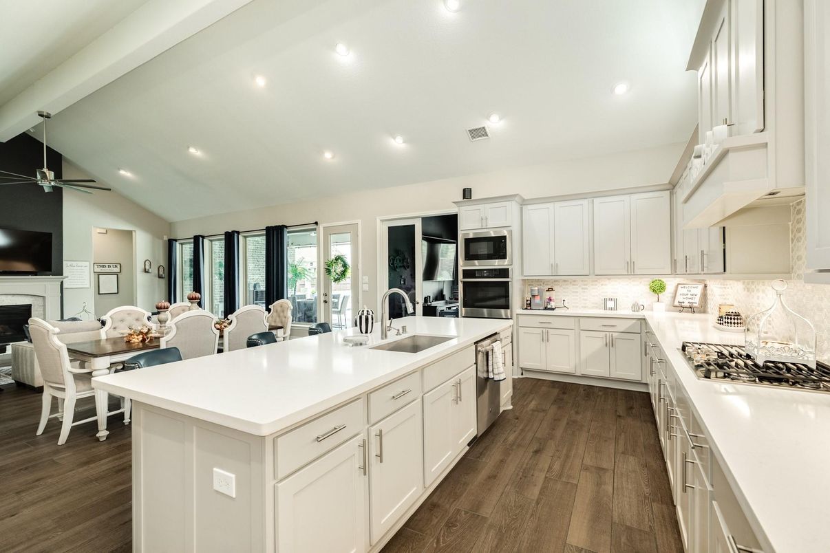 Dining room, Interior, Kitchen, Recessed Lighting, Stainless Steel Appliances, Wood Texture Flooring